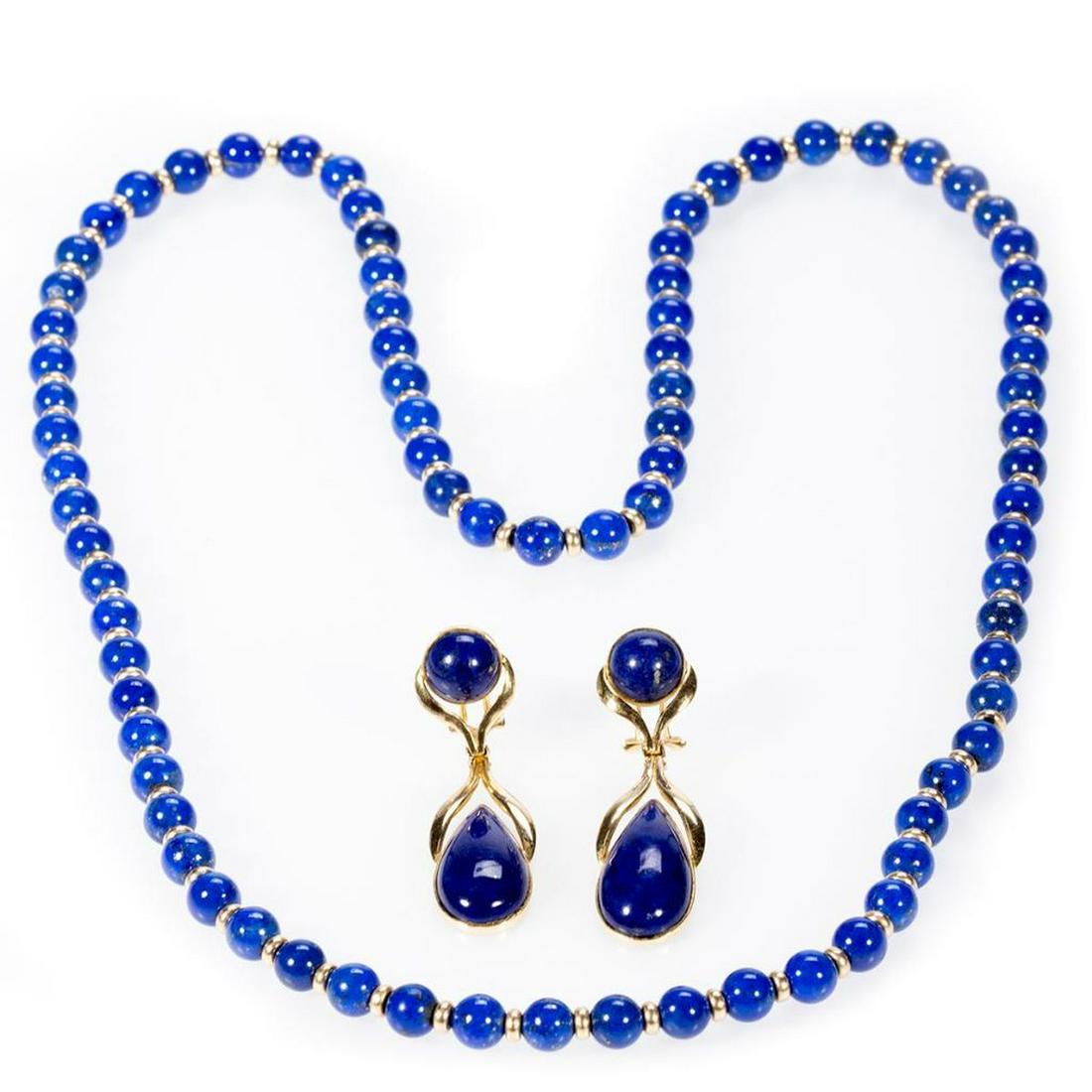 Lapis lazuli and 14k gold jewelry: comprising a pair of pendant earrings featuring round and pear-shaped lapis; gross weight: 11.3 grams; length: 2in.; together with an endless necklace alternating with lapis beads measuring 7.3mm and 