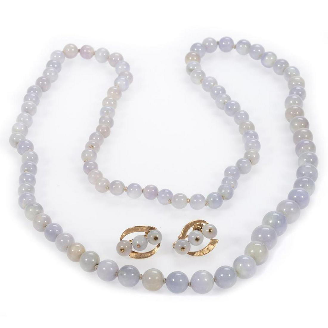 Lavender jade & 14k gold jewelry: comprising a graduated, endless necklace, with beads measuring from 12.2 to 7.5mm, length: 34in.; together with a pair of screw-back earrings featuring 6.5mm lavender jade beads and weighing approxima