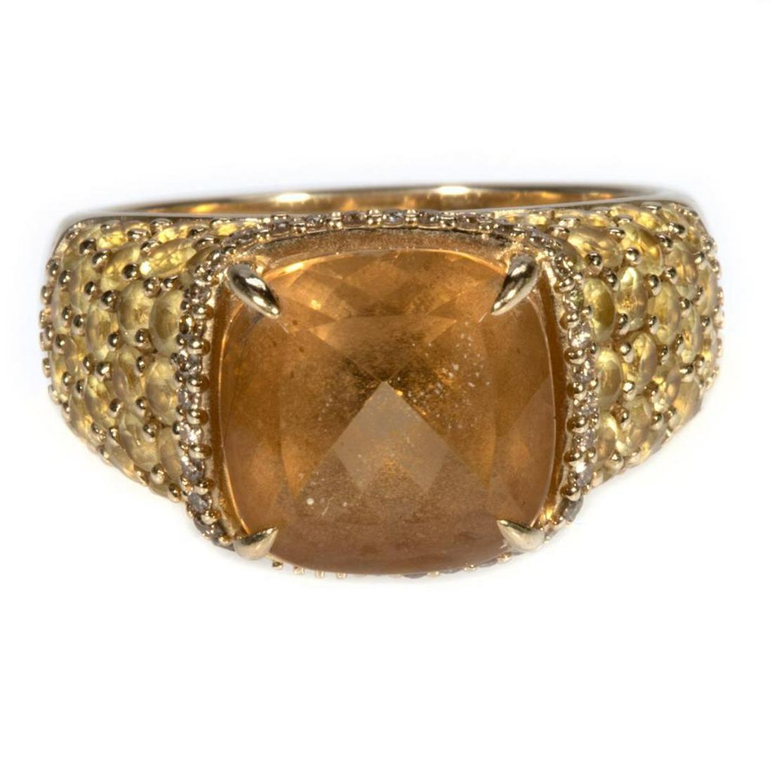 Semi-precious, colored diamond and 14k gold ring: centering an cushion-shaped orange beryl measuring approximately 10.2 x 10.2 x 7.15mm, accented by 32 light brown round brilliant-cut diamonds weighing in total approximately 0.15ct., and further set 