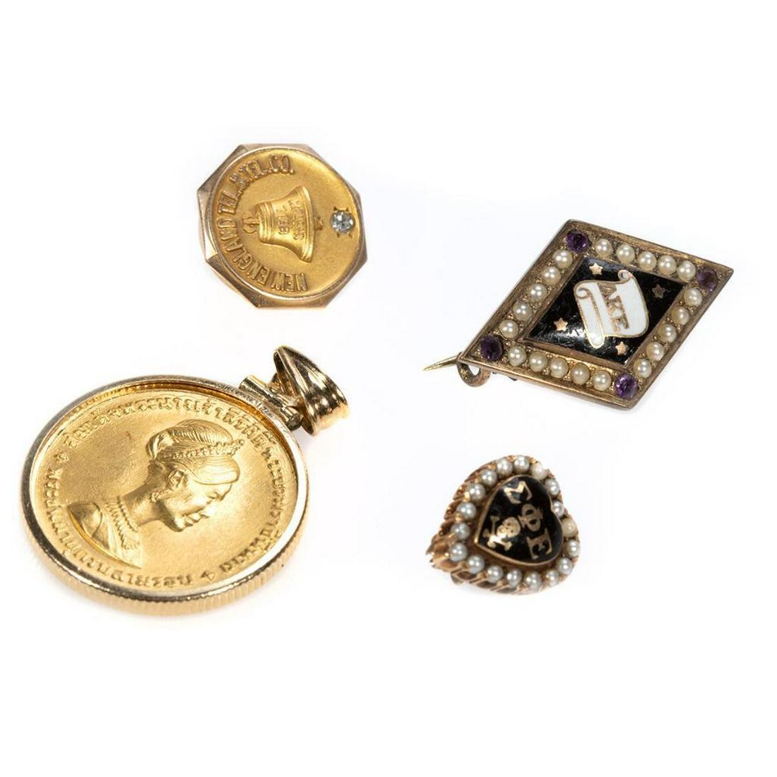 Thai gold coin pendant together with masonic brooches: 1968 300 Baht Queen Sirkit Commemorative gold coin with 14k gold pendant frame; with 10k gold masonic brooches and New England Tel & Tel Co. collar button; gross weight: 16.6 grams