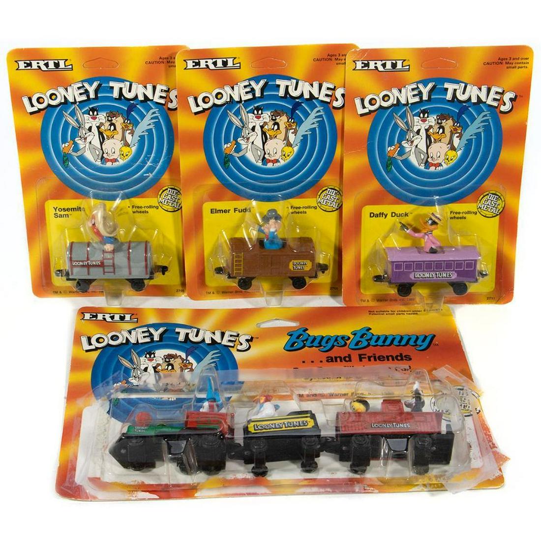 Ertl Looney Tunes Train: 2709; New Old Stock; Looney Tunes Elmer Fudd Gondola 2708; New Old Stock; Looney Tunes Yosemite Sam Tank Car 2711; New Old Stock; Looney Tunes Daffy Duck Coach 2721; Opened Stock; Looney Tunes Bugs Bu