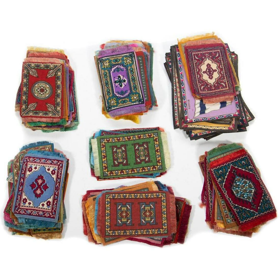 Sixty (60) Antique Tobacco Felts: A collection of approximately sixty Persian and Oriental Rug patterns 5in. 2 1/2in. And approximately twenty flags, including Zion, Samoa, Poland 6in. X 4in.