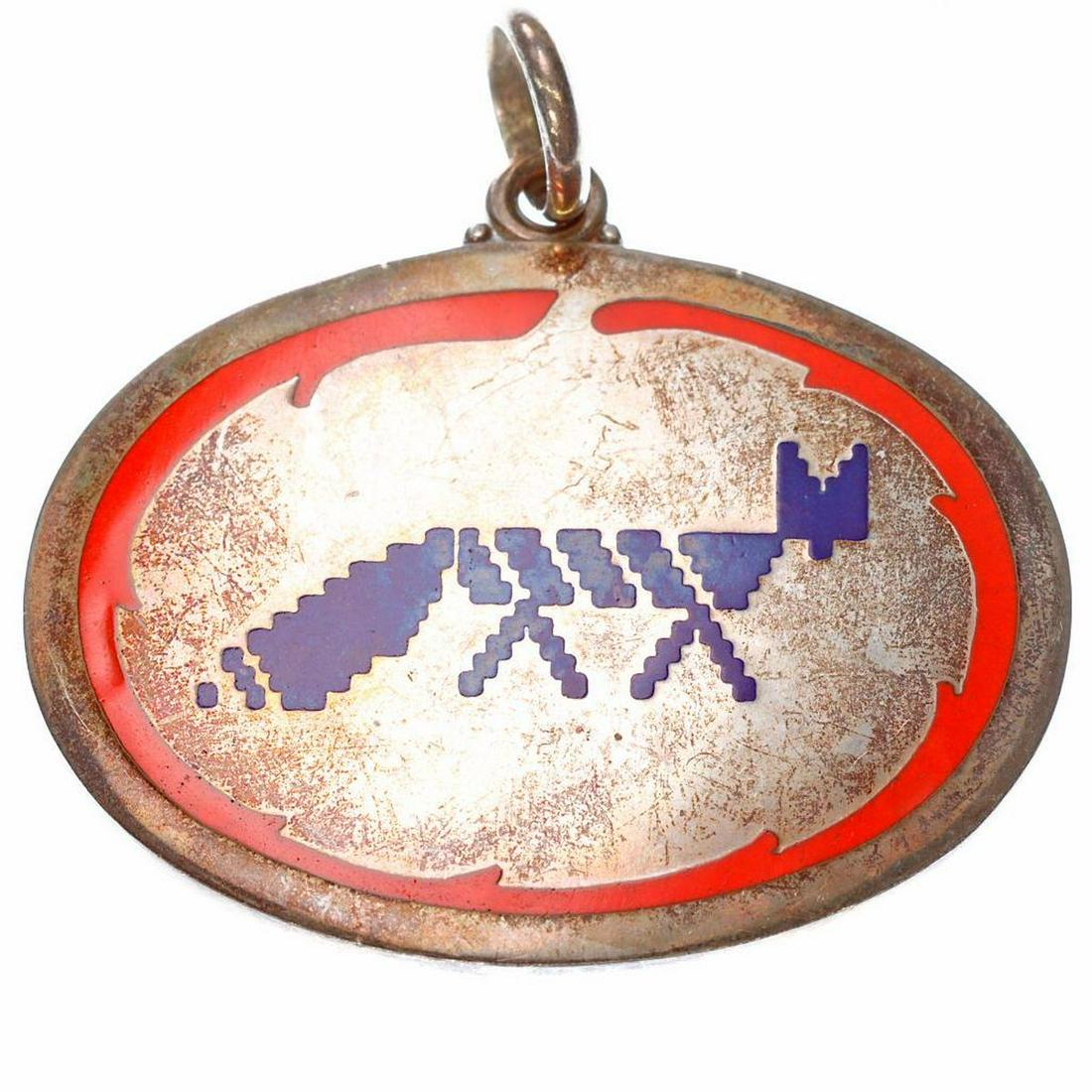 Buccellati silver and enamel medallion pendant: designed with blue fox with red border; signed Gianmaria Buccellati 925; weighing 27.6 grams; measuring 2 x 2in. (moderate scratching to surface)