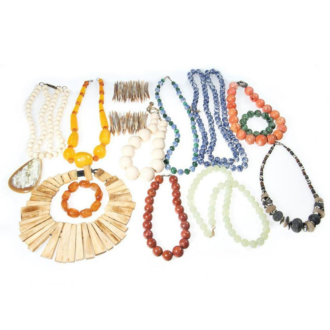 Collection of beaded, silver and metal jewelry: comprising 10 necklaces and 4 bracelets, including amber, ceramic, carnelian, malachite, shell, wood and bone
