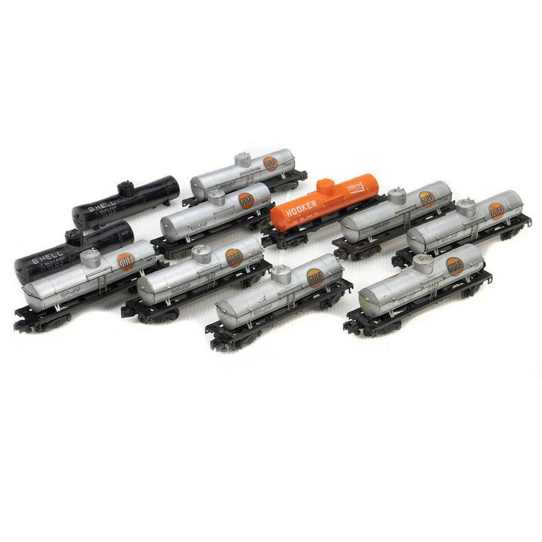 American Flyer S Gauge Tank Cars: UsedTank Cars: 925 Gulf with plastic frame missing four steps, missing one marker, knuckle coupler trucks, paint worn, dome, ends and hand rails present; 925 Gulf with plastic frame missing one step, 