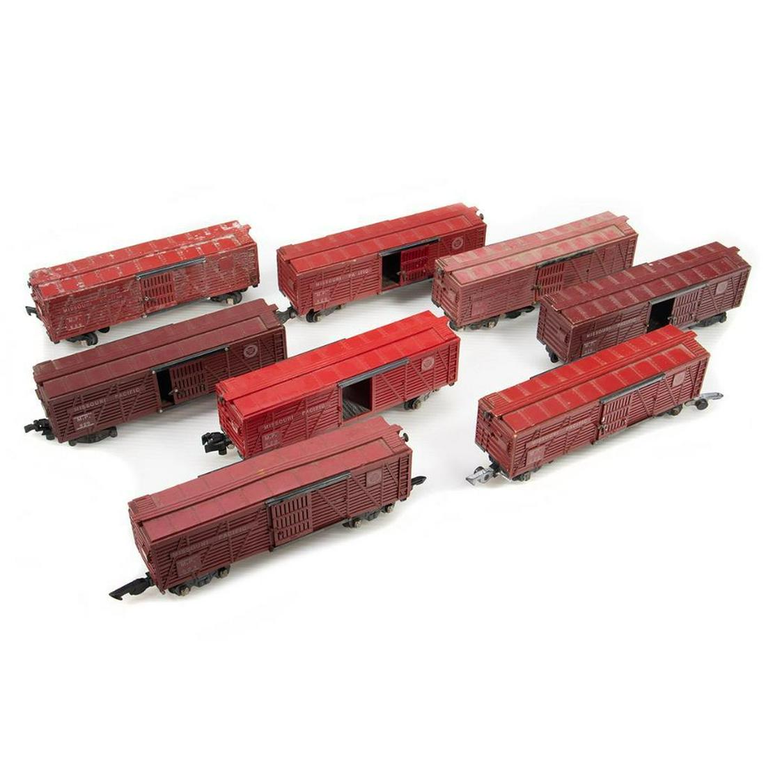 American Flyer S Gauge Stock Cars: UsedStock Cars: 929 Missouri Pacific, doors, door guides and latches intact, roof walk ends intact, missing brake wheel, damage to one roof corner, rust spots on chassis, missing 3 wheel sets and one 