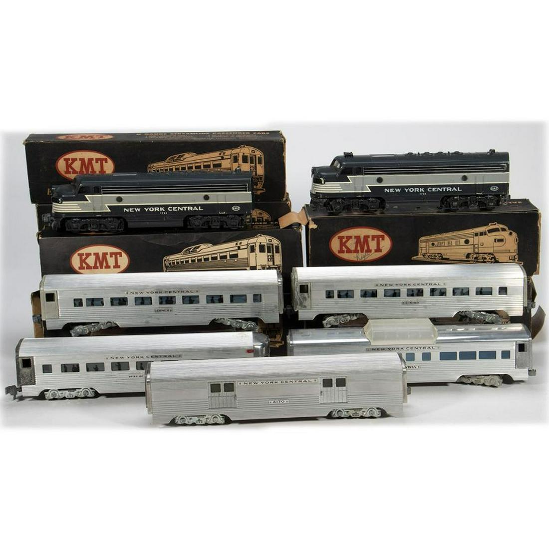 KMT New York Central A-A F Unit locomotives and 5: KMT New York Central Streamliner. Powered and Dummy 1733 F units with New York Central lettering and partial boxes. Dummy unit is missing horns. Each unit is missing one coupler. C-3008 New York Centr