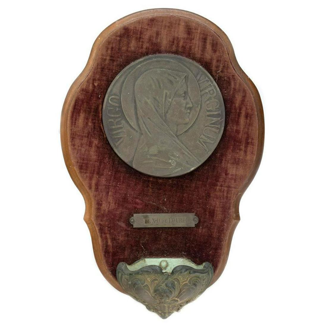 Two European Wall-Hanging Incense Burners: One metal cross with two angels holding a shell/incense receptacle, mounted on a blue velvet-covered board/frame (12 1/2" x 9 1/4"); the other a Virgin of Lourdes medallion with incense receptacle mou