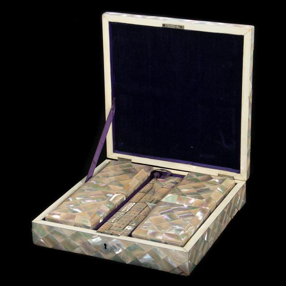 19th Century Mother-of-Pearl Cribbage Box: 19th century mother-of-pearl cribbage box. The wooden box inlaid with an allover geometric design, with a beveled lid. The lid has a central etched design. The interior is lined with purple velvet and