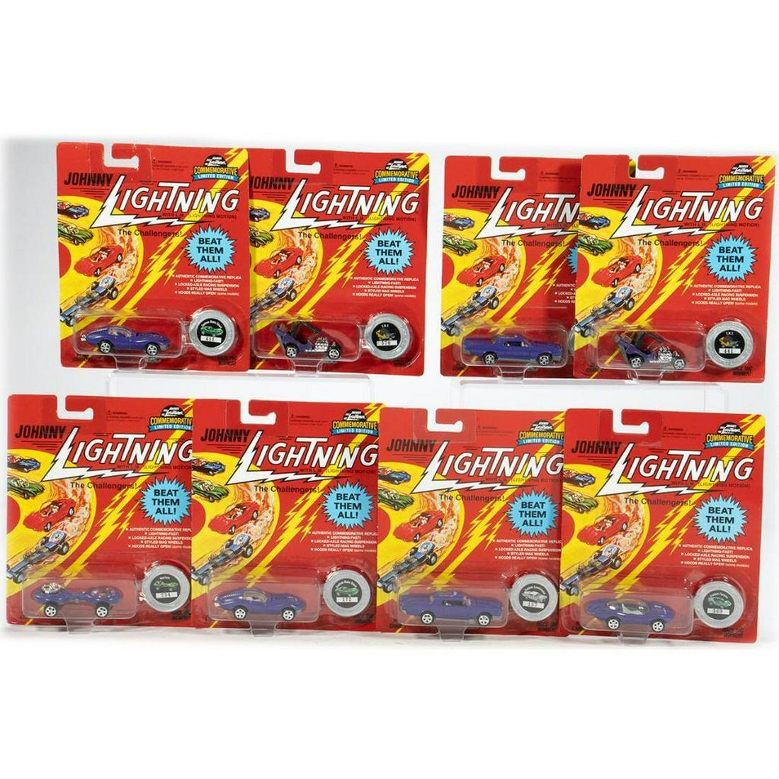 (24) Johnny Lightning Challengers. Black Token w/#, Purple w/"Toy Fair '96": Johnny Lightning The Challengers with Lightning Motion. All cars are purple with "Ride the Storm Toy Fair '96" label. Limited Edition Token with black center and number. #109 Continental. #157 #109 Co