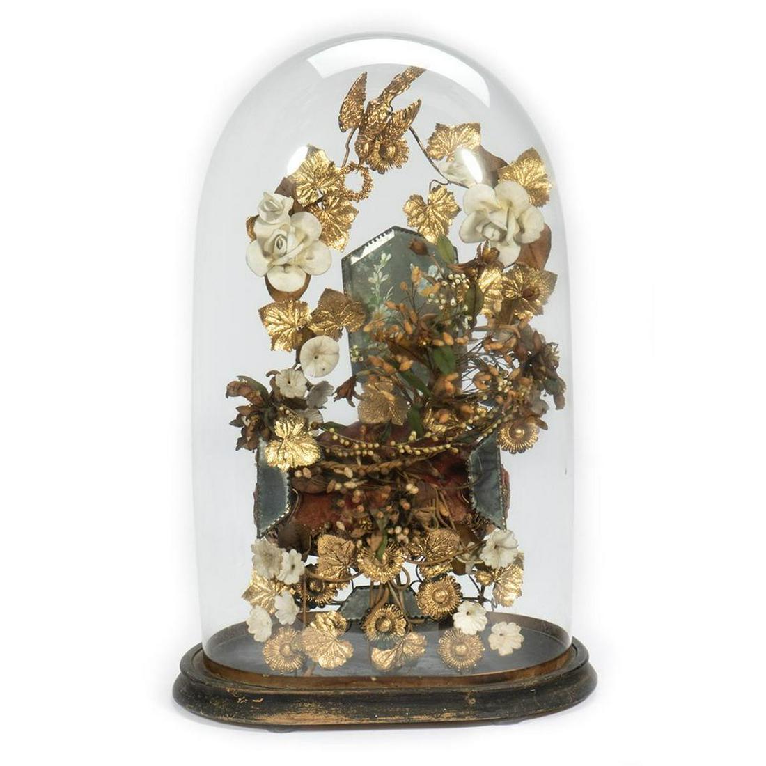Victorian Gilt Vine Arrangement Under Glass Dome: Centered by a padded red velvet stool and floral-painted mirror, the arrangement is comprised of gilt-metal vining leaves, with porcelain and fabric flowers and buds, topped by a metal bird wreath. Th