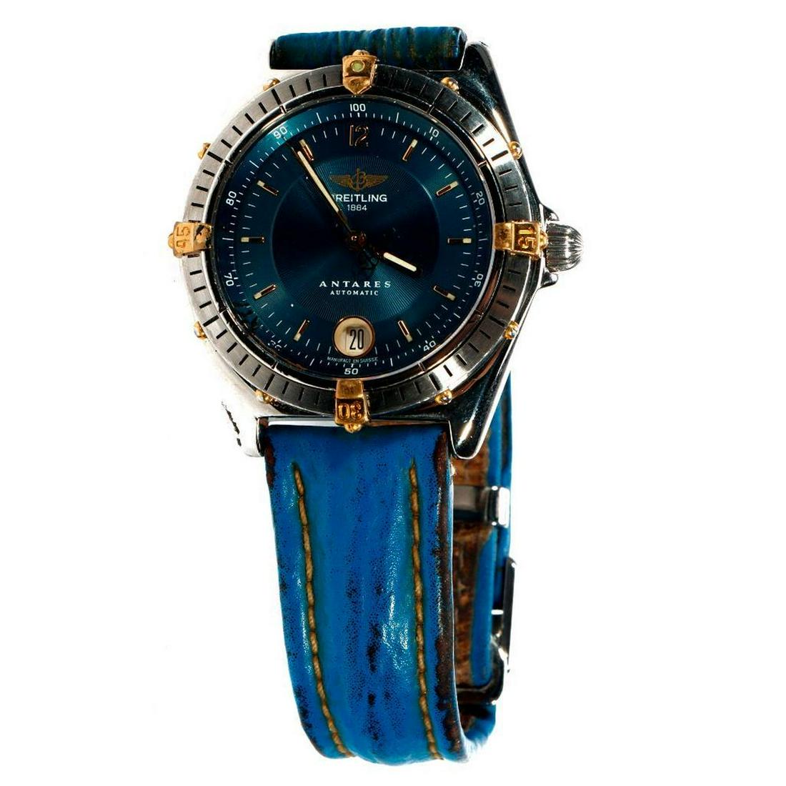 Breitling 'Antares Serie Speciale' stainless wristwatch: automatic, 200m, gold and steel round case with blue dial and blue leather strap, date at 6 o'clock; signed dial, case, clasp (movement not accessed, not tested for accuracy, moderate wear)