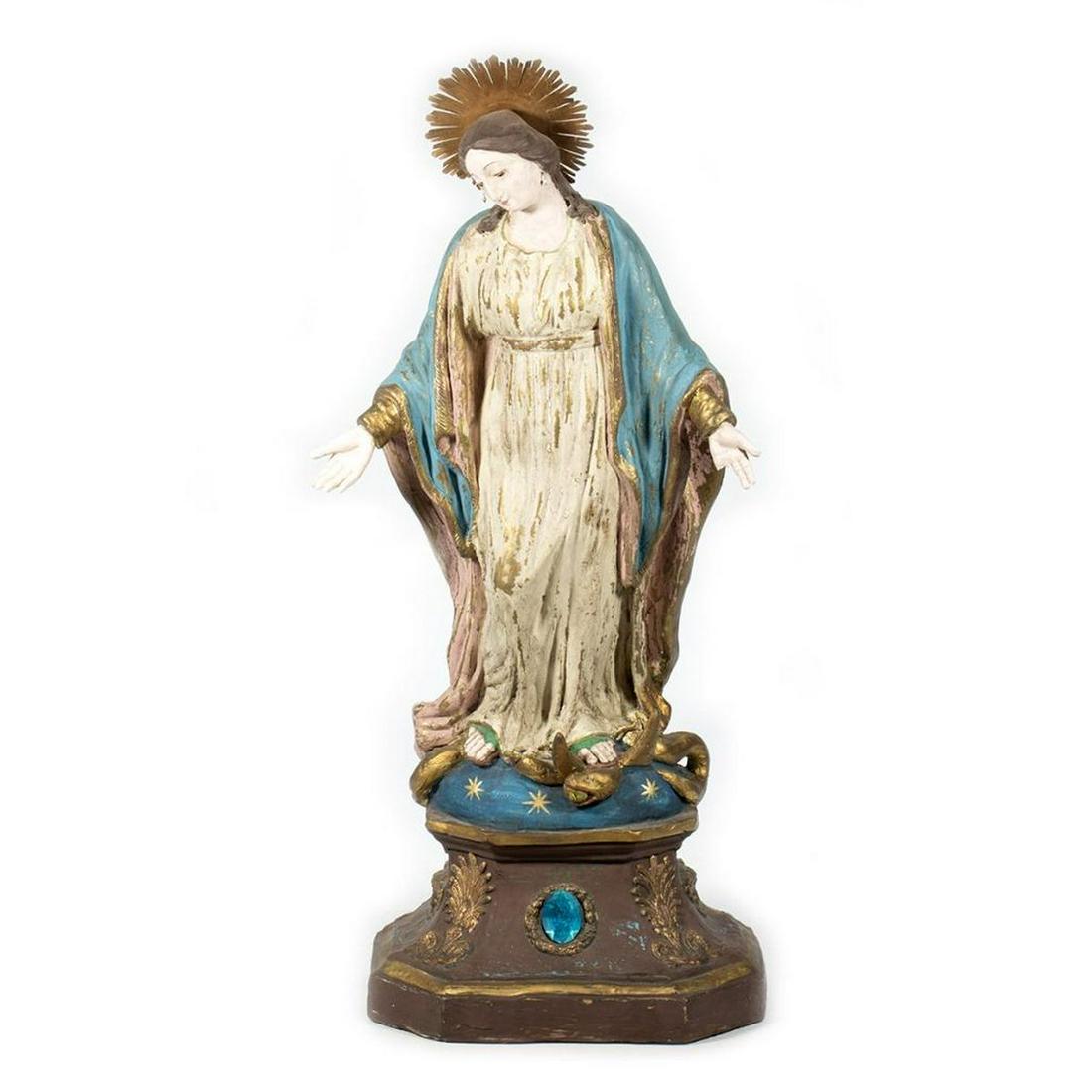 Painted Composition Altar Figure of Mary: The figure with glass eyes, her feet treading on a serpent upon an integral base that is embellished with a blue "jewel." 28 h. x 13in. w. x 7in. d. Condition: Possibly with paint repairs; two fingers