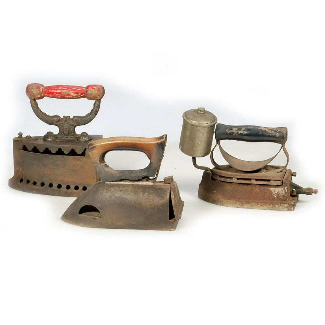 Two antique coal/charcoal irons and an antique kerosene iron (1 of 3)