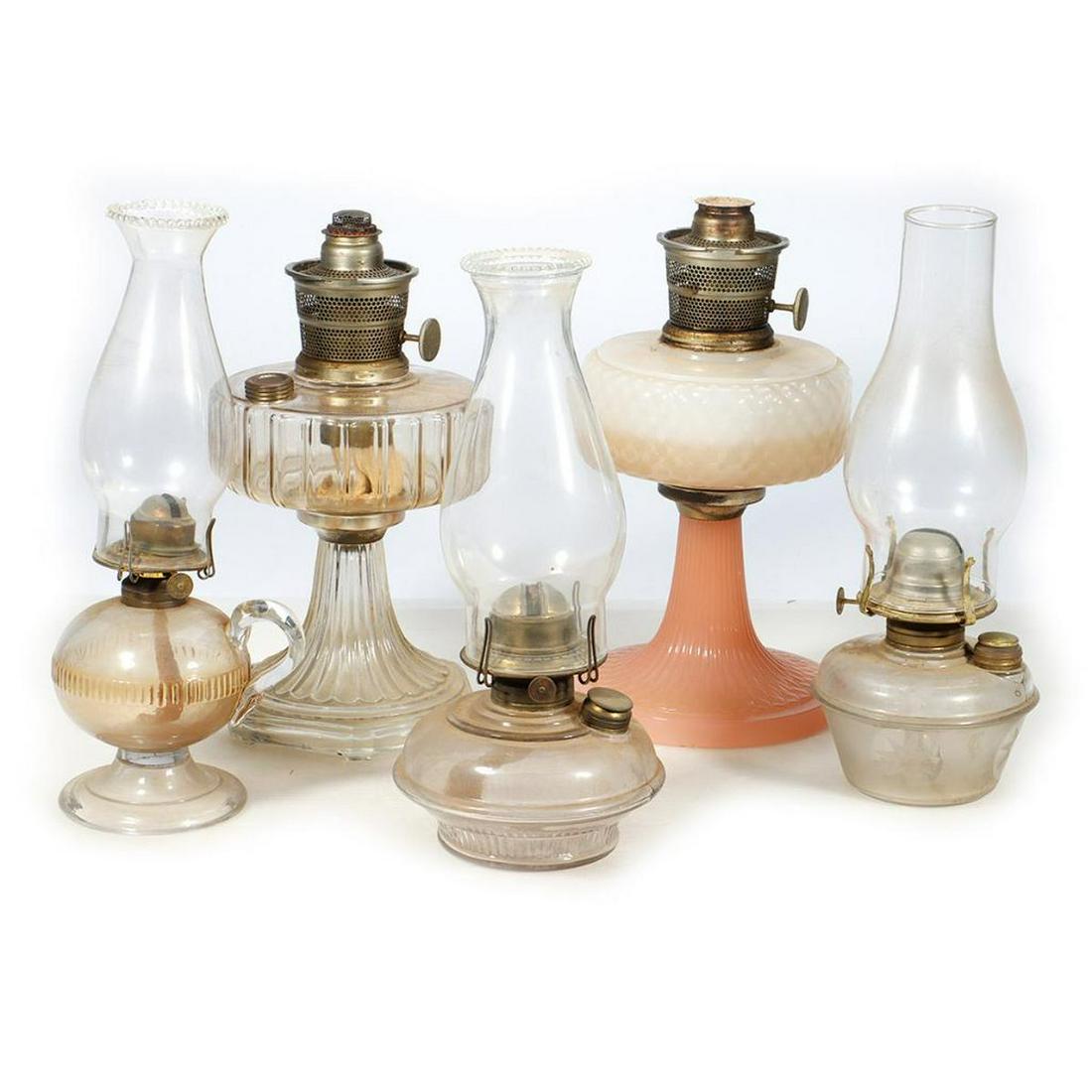 Kerosene Lamps - Aladdin and more: Kerosene Lamps: Aladdin and more: 1. Aladdin Nu-Type Model B, clear reservoir and base - about 7 inches diameter. Dusty, no fitter 2. Aladdin Nu-Type Model B, white reservoir with pink base - about 7 