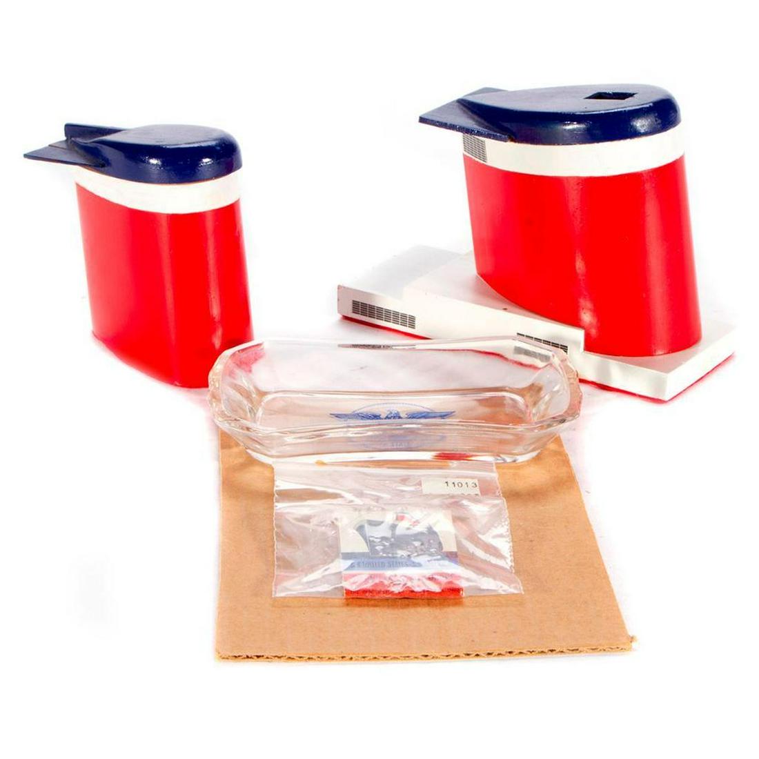 GROUP OF OCEAN LINER MEMORABILIA.: Comprising a United States Lines glass pin-tray with logo, two handmade funnels, and a matchbook.