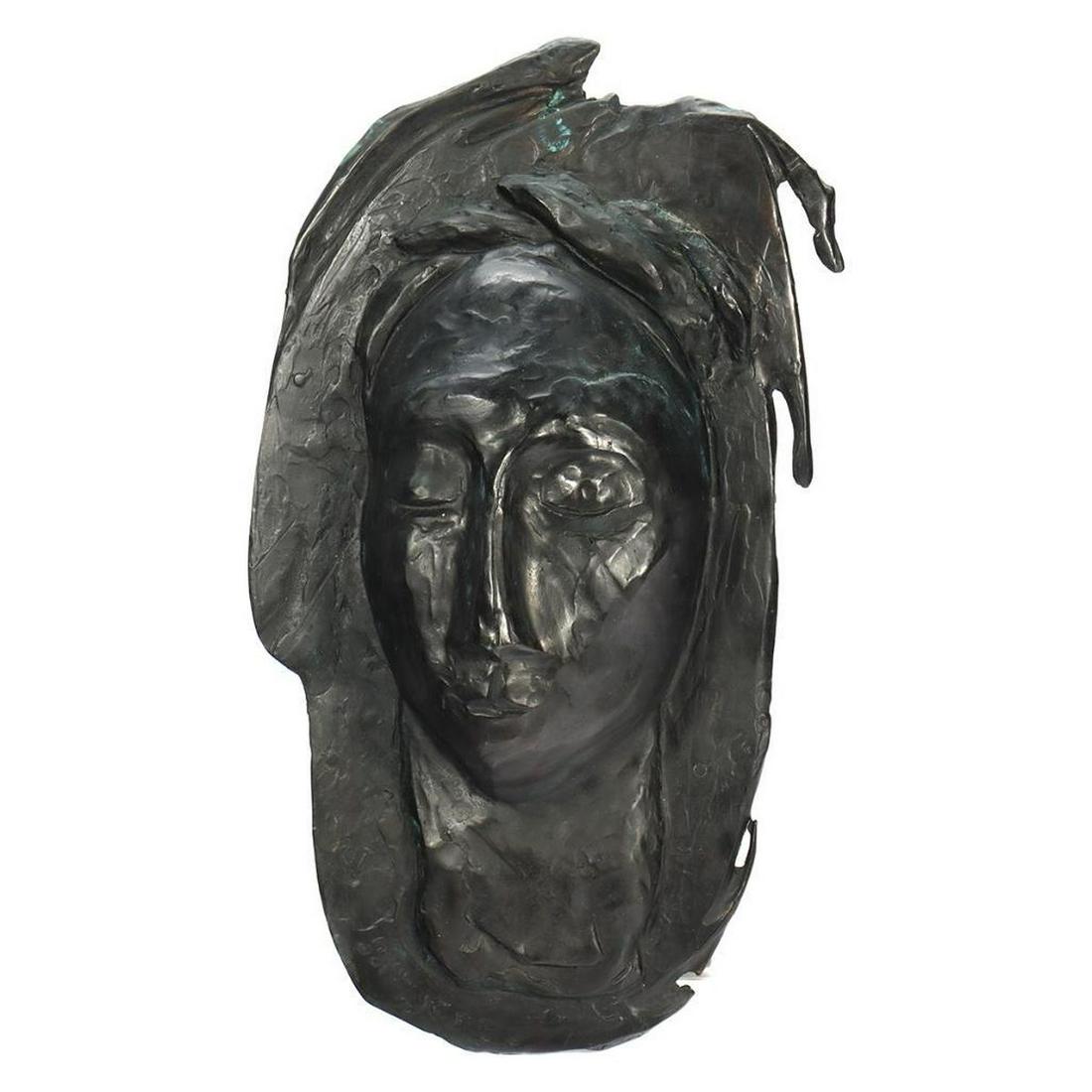 Eleen Auvil (1927 - 2022): Artist: Eleen Auvil (1927 - 2022). Title/Subject: Elongated mask with border. Size: 19in. x 10 1/2in. Year Created: 2001. Signature: Signed and dated lower left. Medium/Ground: Cast bronze. Condition