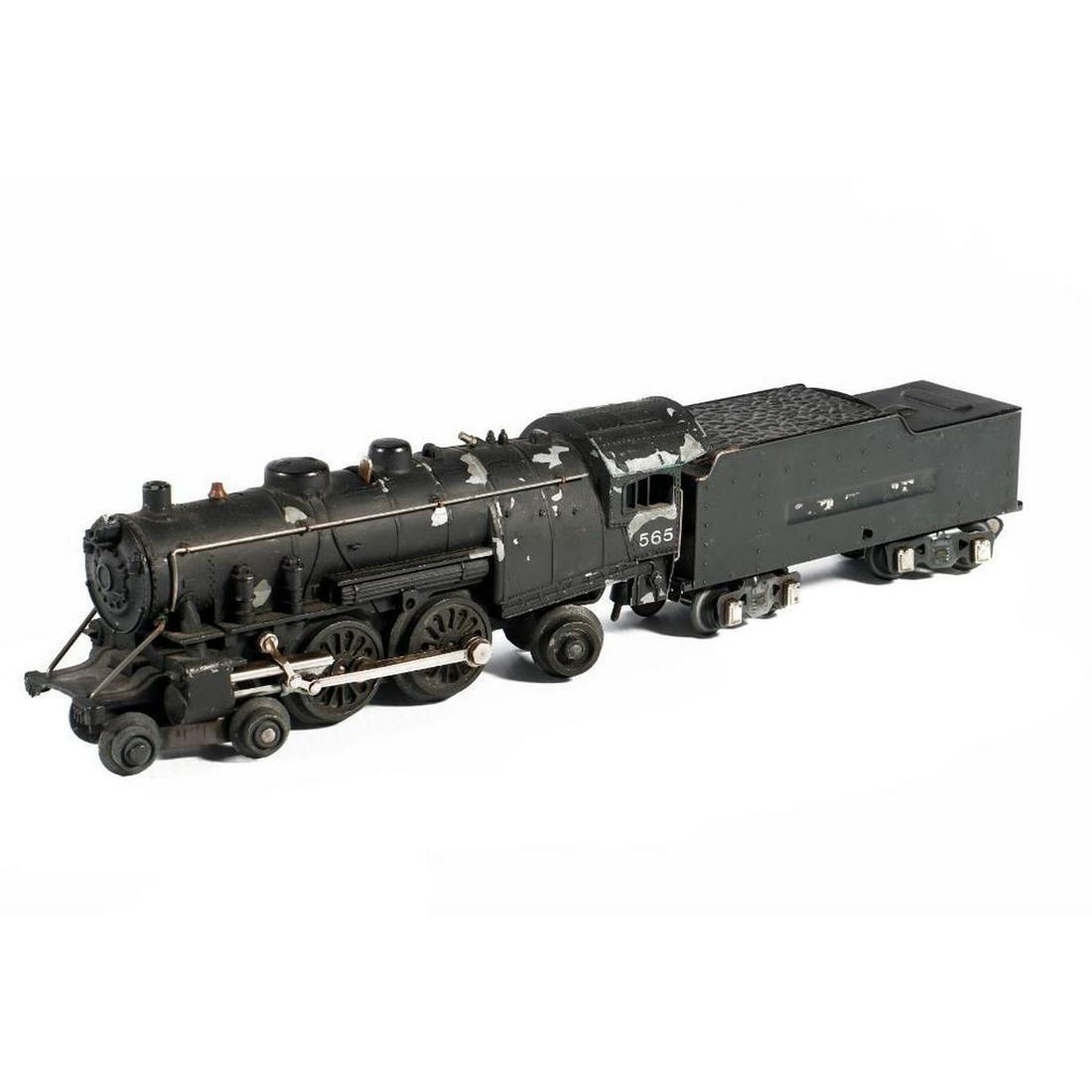 American Flyer O Gauge Prewar 565 Atlantic Loco and Tender: American Flyer O Gauge Prewar 565 Atlantic Locomotive and Tender Locomotive has flaking paint. Cow catcher is broken off and missing. Pilot and trailing wheels are starting to crumble. Headlight is br