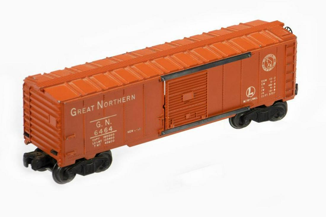 Lionel 6464-25 Great Northern Box Car: Lionel 6464-25 Great Northern Box Car. Roof walk ends, brake wheel, doors, door guides, trucks and couplers intact. damage to orange paint at brake wheel end. Corner must have hit something and roof w