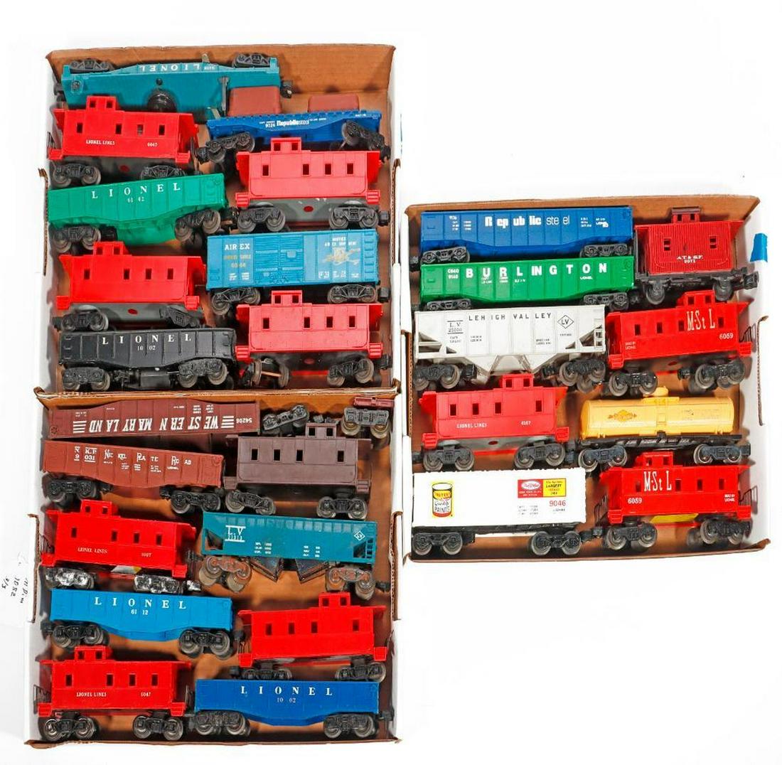 26 Lionel Scout coupler and solid knuckle coupler freight cars: 26 Lionel Scout and solid knuckle coupler freight cars Scout cars: 1. 1002 Blue Gondola. Trucks and scout couplers intact. Lettering has scratches. 2. 1002 Black Gondola. Trucks and couplers intact. O