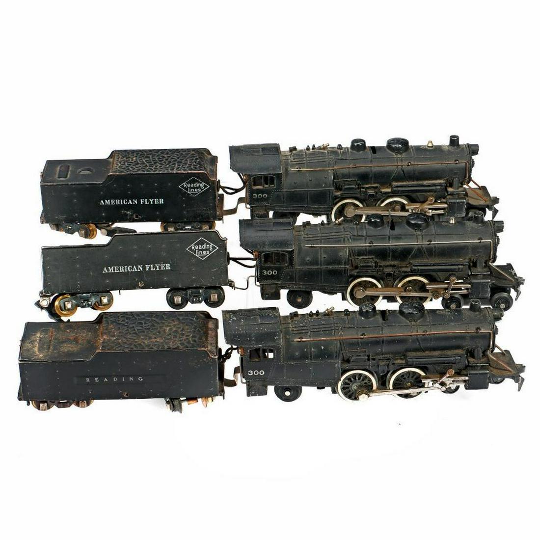 3 AF S Gauge Die Cast Atlantic Locomotives. 300, 300, 300.: 3 American Flyer S Gauge Die Cast Locomotives 1. 300 Reading Lines/American Flyer with sheet metal tender. Hand rails and rods intact. Tender ladder and trucks intact but link coupler has been replace