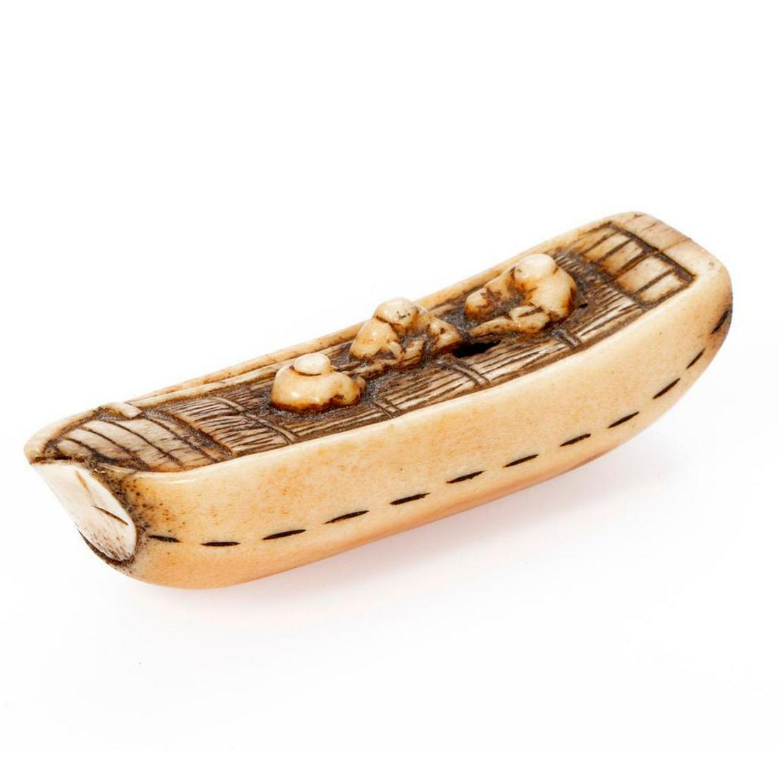 Vintage carved netsuke.: In the form of a boat with three men, measuring 2 7/8 x 3/4in (minor damage). Condition Report: All lots are sold as is and where is. Turner Auctions + Appraisals, LLC provides condition reports upon 
