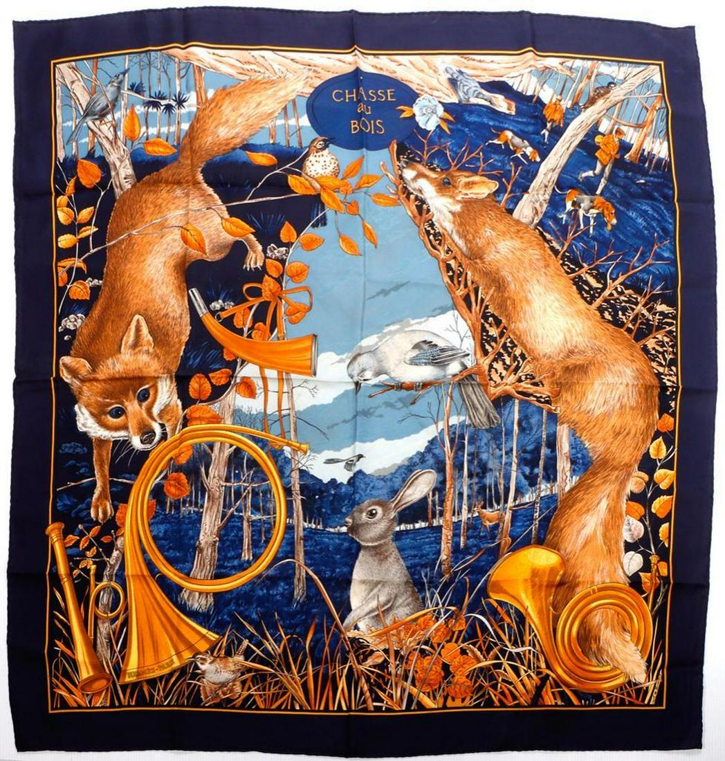 Hermes Paris "Chasse au Bois" Silk Scarf.: Carl de Parcevaux, navy forest animal/hunt theme, approx. 35in x 34 1/2in; copyright and hand-rolled edges.Good used condition, some light soiling. Condition Report: All lots are sold as is and where