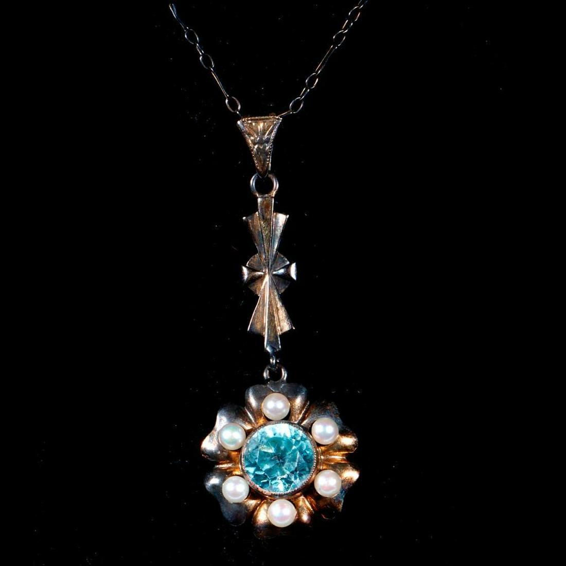 Antique 14k gold, zircon, seed pearl pendant-necklace.: Featuring a round blue zircon measuring approximately 7.4 x 4.8mm; weighing approximately 3.0 grams; pedant length: 1 1/2in., chain length: 15 1/2in. (abrasion to zircon, heavy oxidation). Condition R