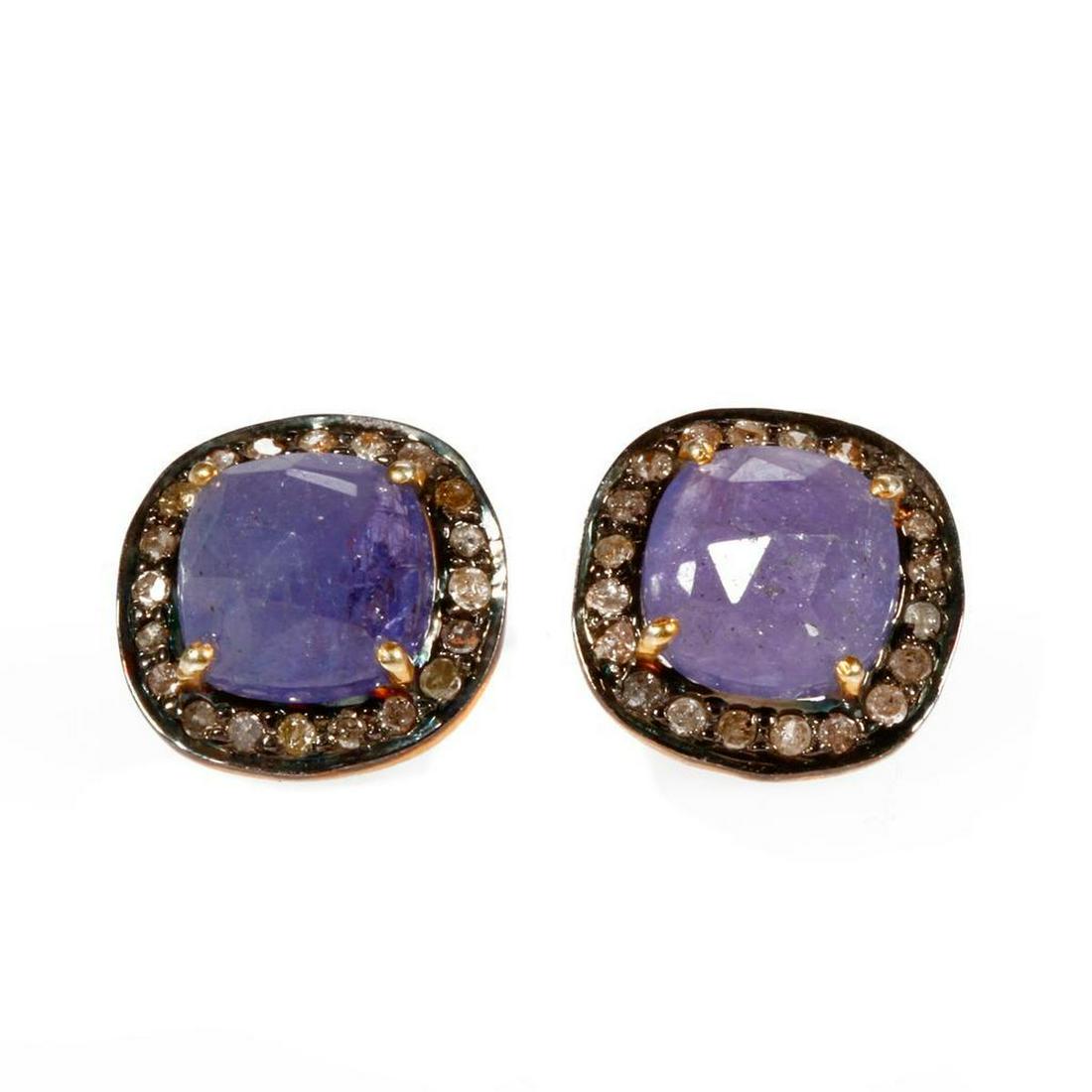 Pair of tanzanite, diamond and silver earrings.: Each set with rose-cut tanzanite's weighing approximately 10.80ct., with round brilliant-cut diamond halos, weighing approximately 0.31ct., Lt. brown/Imp, set in gilt and blackened silver; length: 1/2
