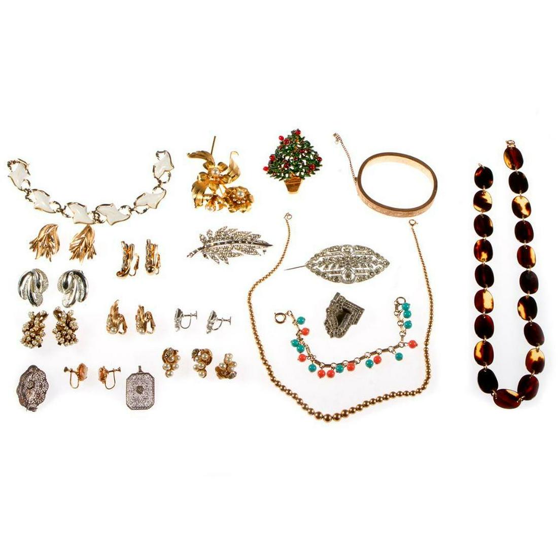 Collection of vintage costume and rhinestone jewelry.: 25 pieces, including Trifari, Pell, Coro, and Marvella. Condition Report: All lots are sold as is and where is. Turner Auctions + Appraisals, LLC provides condition reports upon request to aid in your