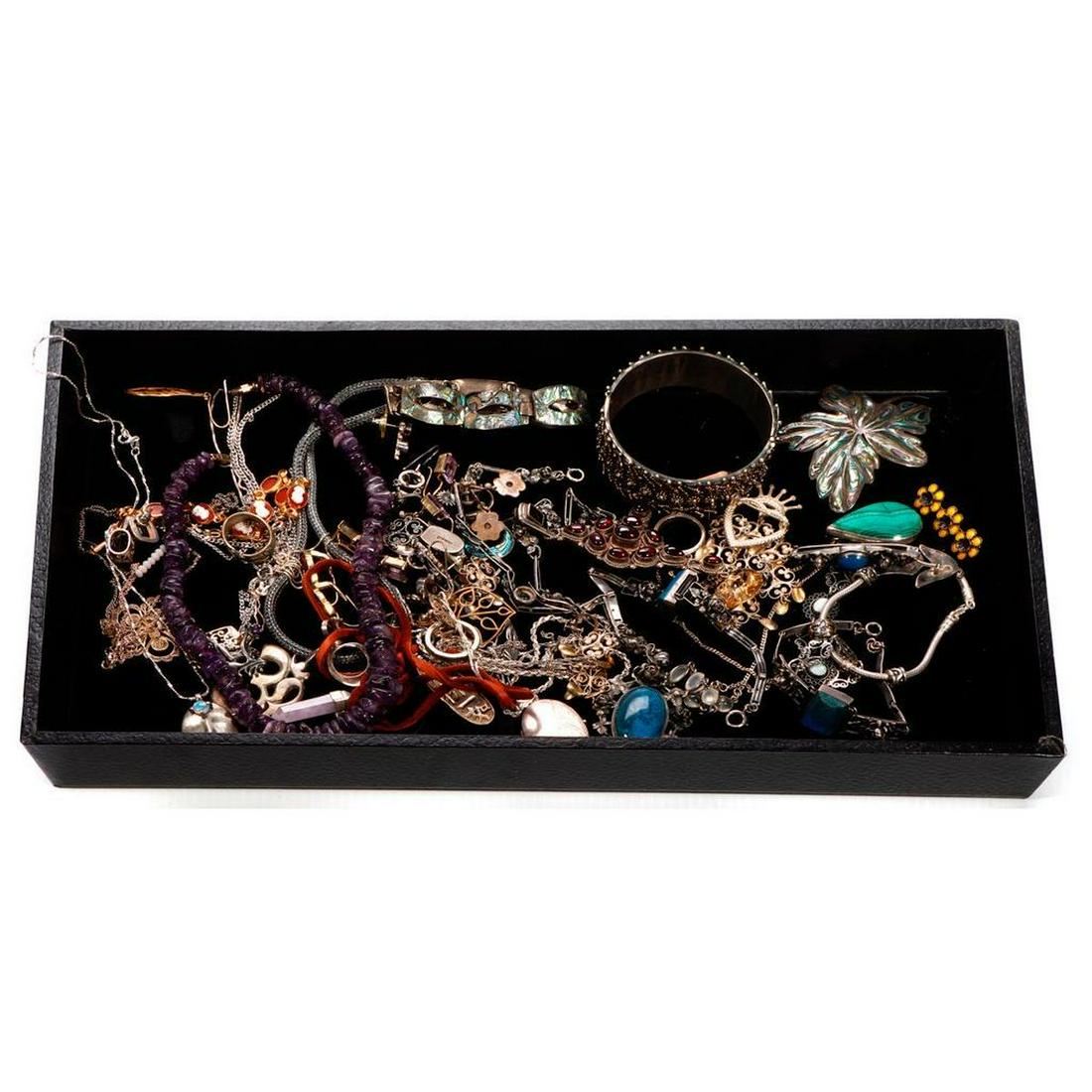 Collection of stone-set, silver and metal jewelry.: 50+ pieces, including amethyst, enamel, abalone, lapis, blue topaz, garnet, opal, tigers eye, sodalite, moonstone, malachite, and quartz; gross weight approximately: 410 grams. Condition Report: All l