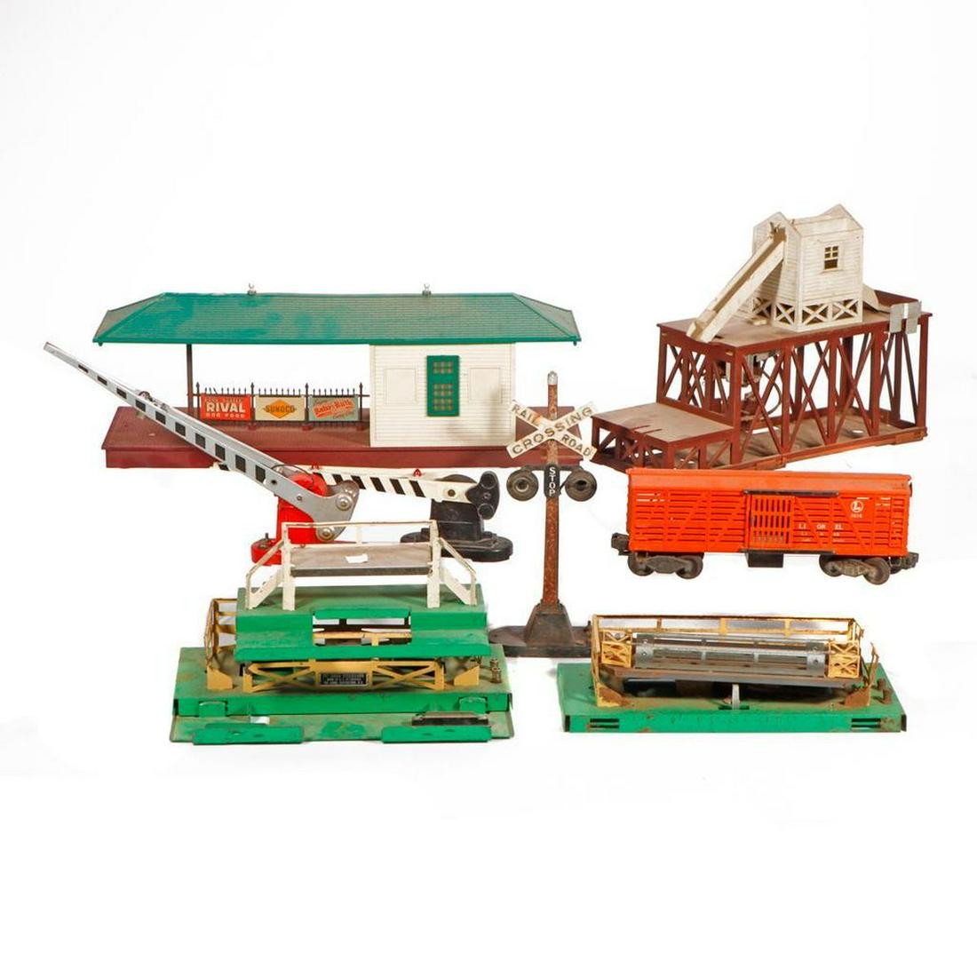 Lionel Assortment of Accessories in need of repair.: Lionel Accessories in need of TLC. (2) 3656 Cattle Loaders with parts for (3) 3656 Cattle cars. 352 Icing Station (no car), 3472 Milk Car and Platform, (2) crossing gates 152, 252 and a 254 crossbuck,