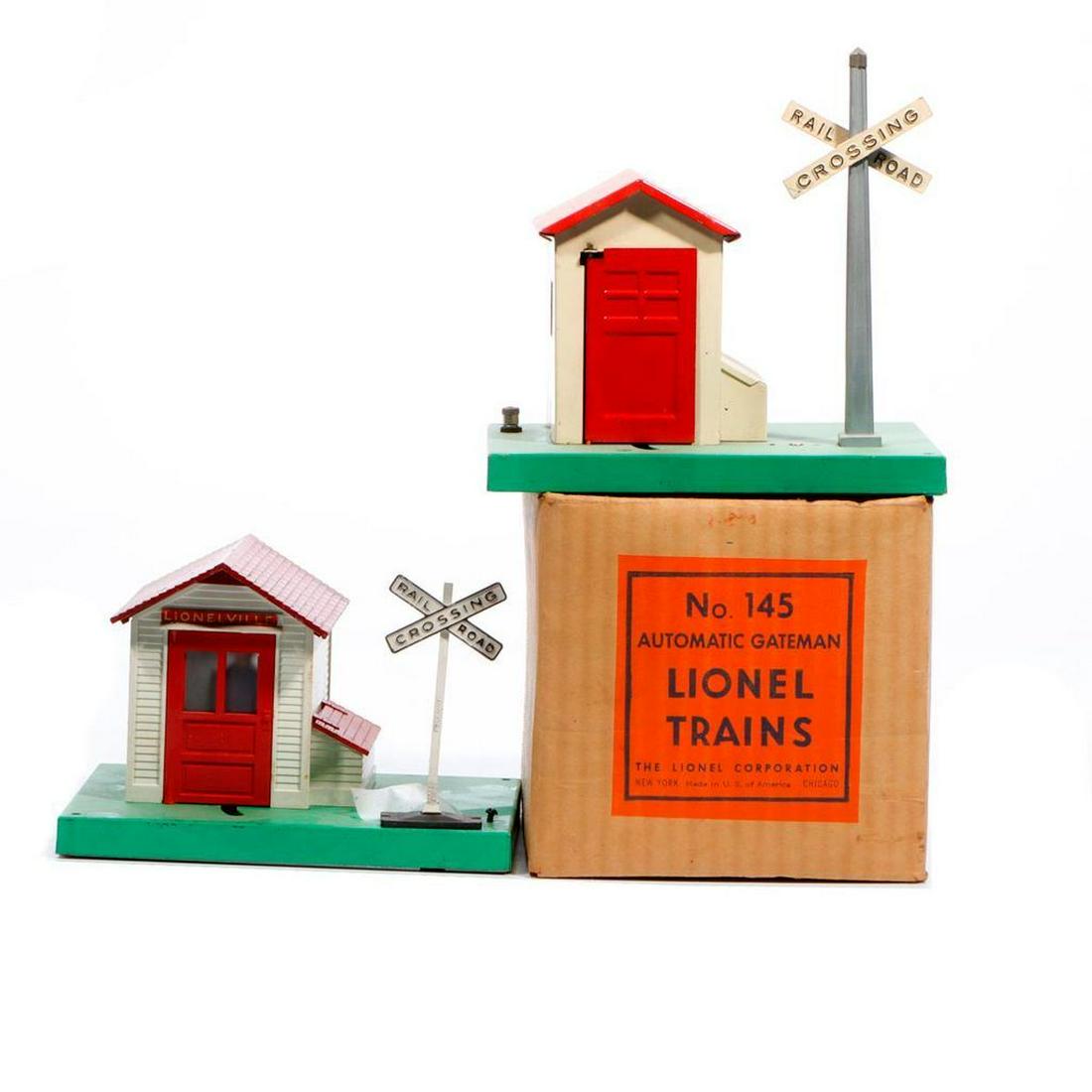 Lionel 45N Gateman and 145 Gateman: Lionel 45N Gateman. Man, arm with lantern, crossbuck, finial, knurled nuts on binding posts all intact. Old price sticker residue on base. Some wear to paint on underside of base. Lionel 145 Gateman w