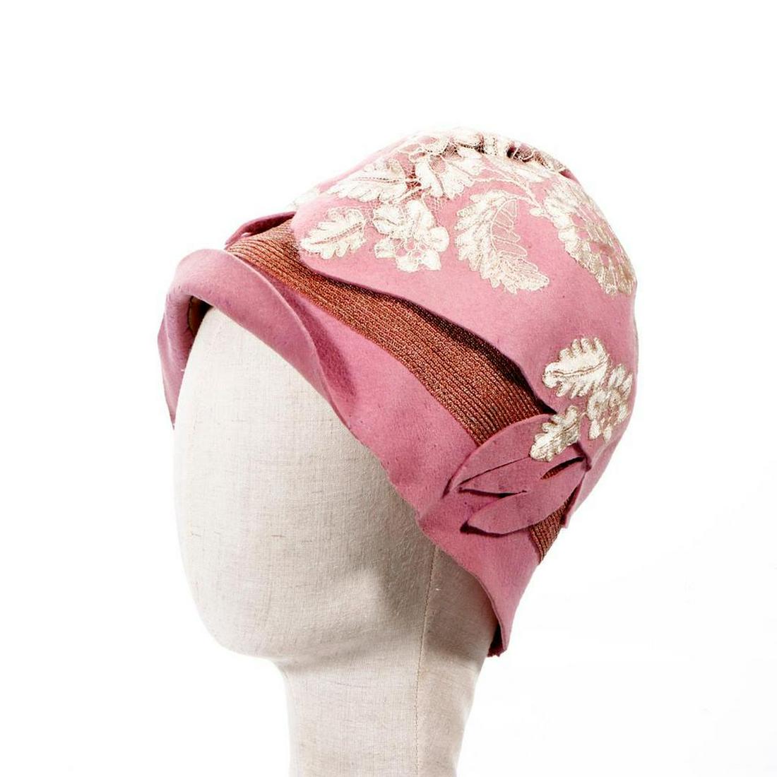 Vintage Pink Felt Cloche Hat.: Appears to be vintage c. 1920s. Felt with applied lace and woven band; lining. Embroidered label: "Glenmore Hats/ New York"; with tag "Large Head Size". There is scattered surface wear or possible mot