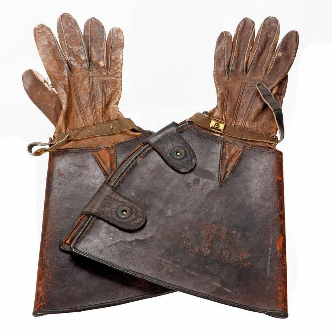Vintage Leather Gauntlet Gloves, c. 1900s.: Women's size. The cuff's 9 1/2in wide. Condition: scuffing/wear, some staining, tear in one thumb, metal button tops appear to be missing.
