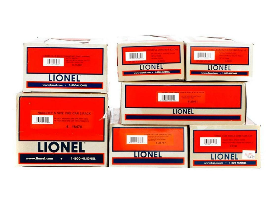 7 Lionel O Gauge Holiday Freight Cars & RMT Caboose: 7 Lionel O Gauge Holiday Freight Cars and a Holiday RMT Caboose 6-39335 Thomas Kinkade Christmas Boxcar 6-36767 Santa's Radar Tracking Car 6-16470 Naughty & Nice Ore Car 2 Pack 6-26061 Lionelville Chr
