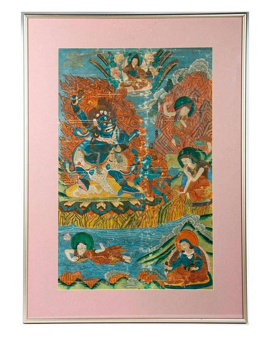 Tibetan Painting of Mahakala.: The fierce blue deity surrounded by figures in spotted robes amidst landscape and clouds. 21 1/8in x 13in (sight); 27in x 19 1/4in (frame). Condition: spots and creases of wear/paint loss.