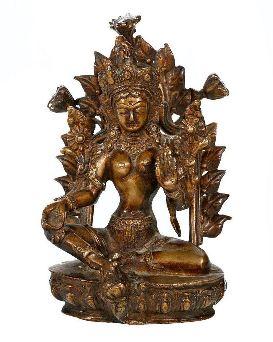 Bronze Tibetan Deity with Halo.: The female figure seated on a lotus-form base; the halo loose/inserts into base. 7 3/4in height. Good condition.