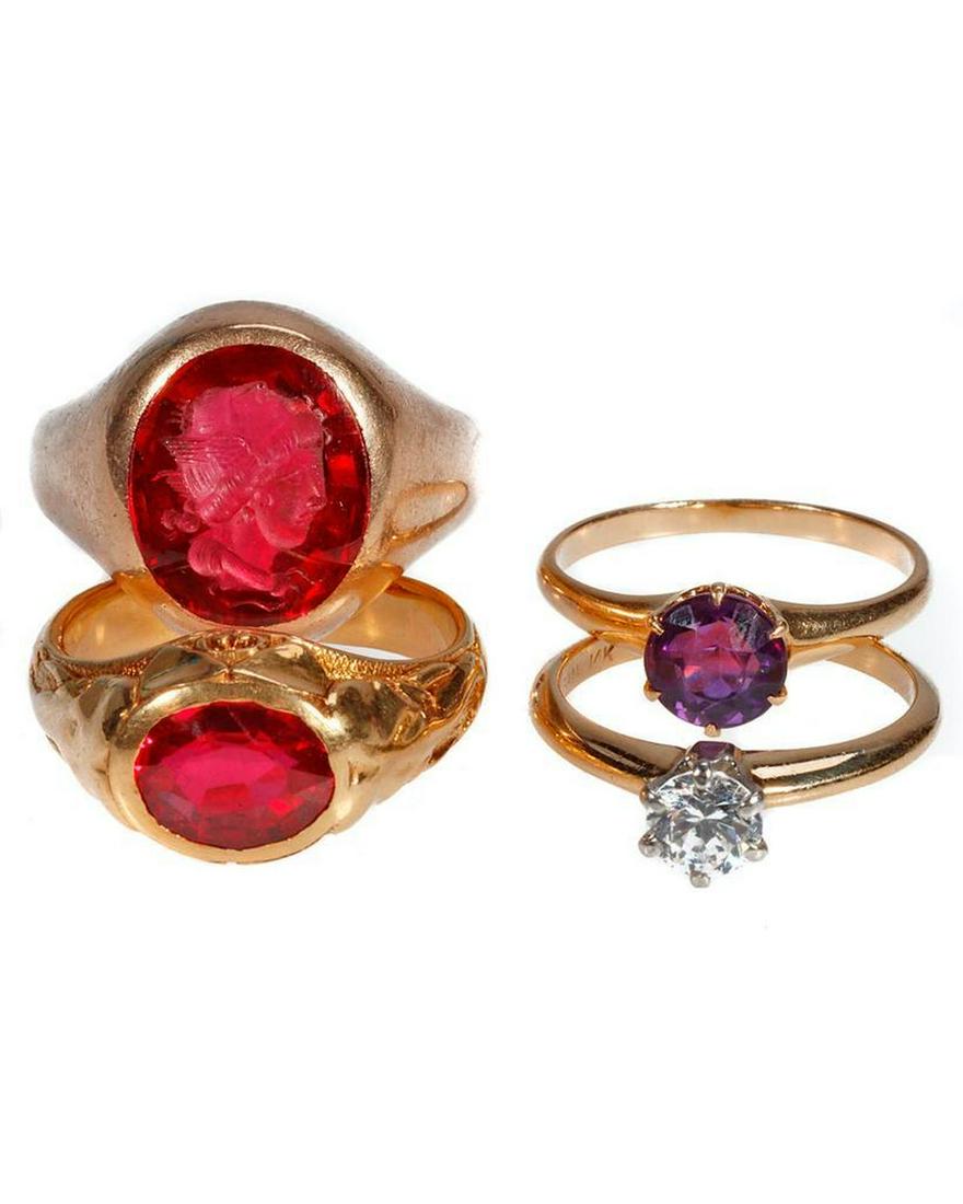 Group of gold and stone-set rings: in 18k, 14k, and 10k gold, set with faceted and intaglio purple, red, and near colorless stones; gross weight approximately 28 grams
