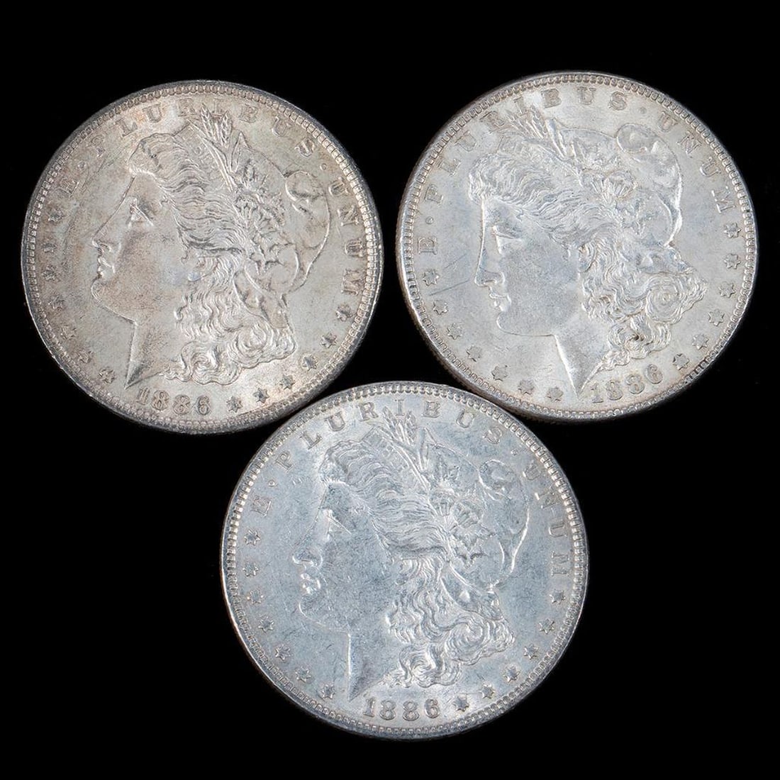 Three 1886 $1 Morgan Silver Dollar Coins (1 of 8)