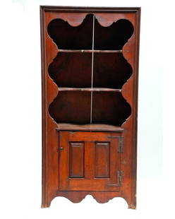 American Stained Pine Cupboard.: Late 18th/Early 19th Century. 76 1/2in h x 37in w x 18in d. Condition: Stains to shelves; minor abrasions, chip losses to moldings and edges of cupboard door; gouges and losses to interior shelves of