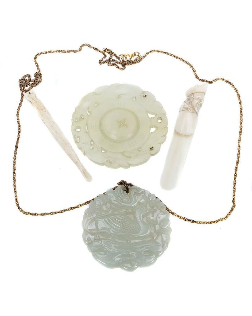 Chinese Jade, Bone and Hardstone Objects.: Comprising a carved jade bird motif pendant with chain, a hardstone bi disk spinning prayer wheel, bone bookmark and nail grooming tool; diameters: 2 ¼ and 2 1/2in, lengths: 3/8in. FROM THE FAM