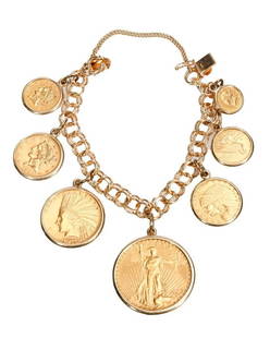 A gold coin and 14k gold charm bracelet: featuring six US coins including a 1923 $20 St. Gaudens Double Eagle, a 1910 $10 Indian Gold Eagle, a 1901 $5 Liberty Half Eagle, a 1912 $5 Indian Head, a 1915 $2 1/2 Indian Quarter Eagle, and a $1