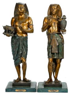 Pair of Egyptian Revival Style Figures.: After Emile-Louis Picault (1833-1915). Both hollow-form metal standing figures marked "Picault" on base. One attendant holds a vase and cover, the other is holding a bull figurine; both on green marbl