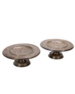 Silver Plate Classical Decorated Platters.: A pair of round pedestal platters with relief decoration of cupids and a maiden in the bounds of love, with romantic legend. Approx. 4in high x 11 3/4in diam.