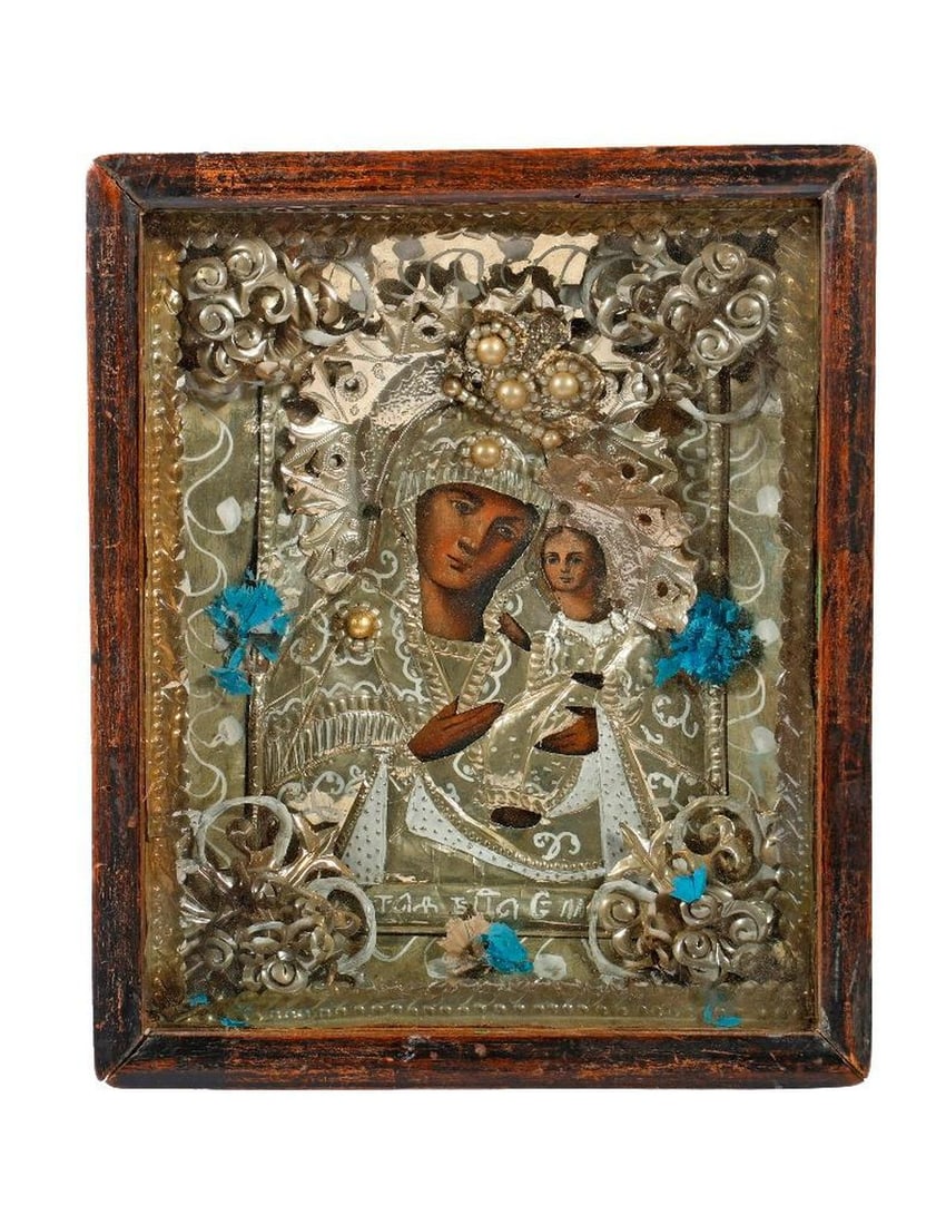 An Icon of the Virgin of Hodegetria in Kiot.: Eastern Europe, 19th/20th Century. A painted icon of the Theotokos as the Virgin of Hodegetria, with foil oklad and ornate foil liner, embellished with faux pearl beads and flowers, in a shadowbox fra