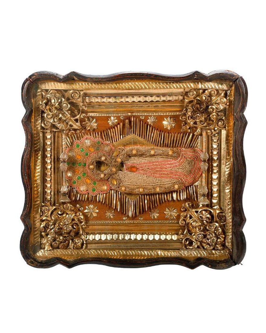 An Icon of the Theotokos with Beaded Shroud, in Kiot.: Eastern Europe, 19th/20th Century. An icon of the Dormition of Theotokos, the Mother of God, painted on wood, with beaded and faux jeweled shroud, mounted on foil-embellished cloth, with an ornate foi