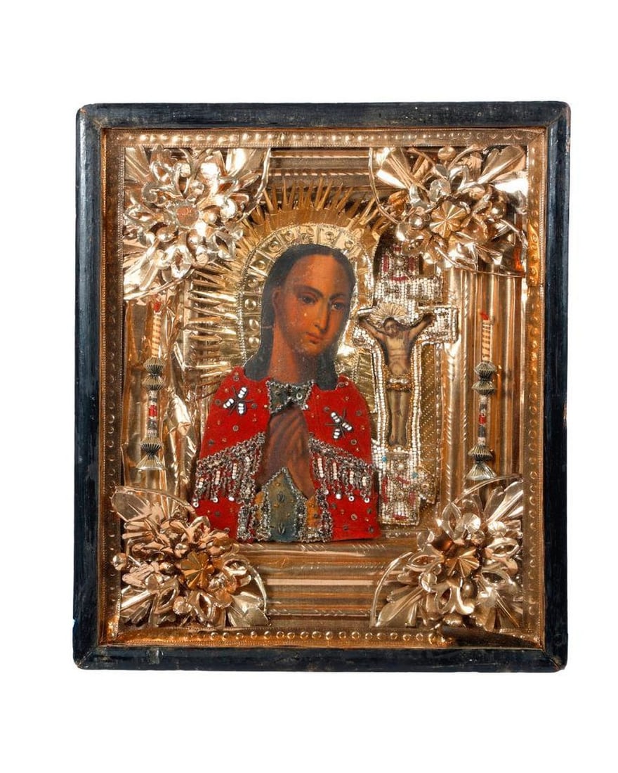An Icon of the Akhtyrskaya Theotokos in Kiot.: Eastern Europe, 19th/20th Century. A painted icon of the Akhtyrskaya Theotokos, Mother of God, her garment beaded embroidered red velvet, a beaded oklad to the crucifixion, with an ornate foil liner i