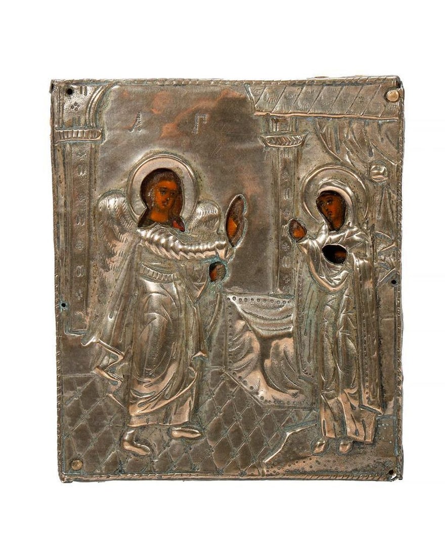 Miniature Icon of the Annunciation.: Eastern Europe, 19th/20th Century. A miniature icon of The Annunciation, tempera painted on wood panel, with a relief silver metal oklad, unmarked. 3 1/4" x 2 7/8". Condition good. Provenance; Private