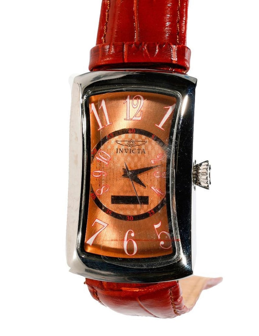 Two Invicta Watches: Two Invicta Watches. NOTE: All watches are sold as is regardless of functionality. Please examine the provided photos to thoroughly evaluate each piece. All watches in the sale have been in storage si